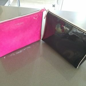 Two pink and black Lancome make up bag